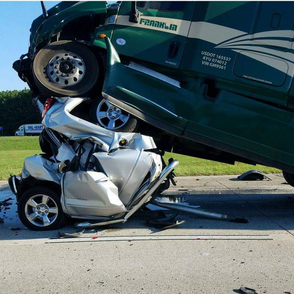 Car Crushed Under Truck